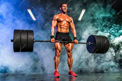Premium Photo Strong Muscular Men Performing Heavy Dead Lift Exercise