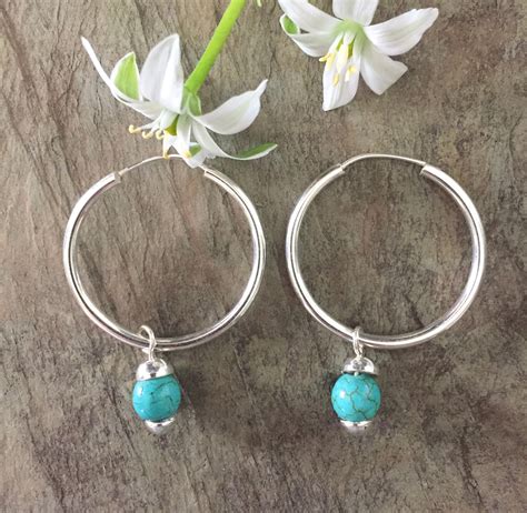 Hoop Earrings In Sterling Silver With Turquoise Drop