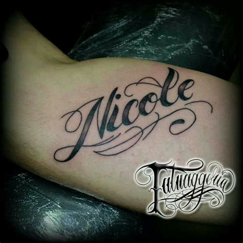 A Tattoo With The Word Nicole On It S Arm And Handwritten Name In