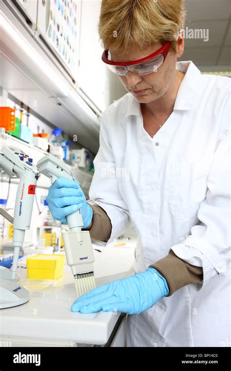 Biotechnology Laboratory Laboratory Assistants Working In A Chemical