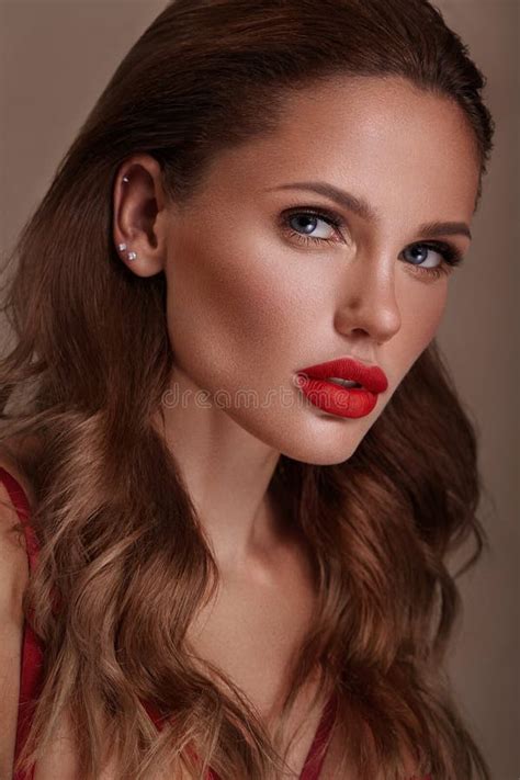 Beautiful Woman In A Hollywood Manner With Curls Natural Makeup And Red Lips Beauty Face And