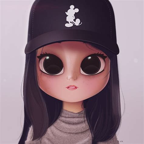 A Doll With Big Eyes Wearing A Baseball Cap