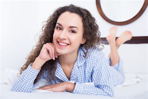 Curly Haired Young Woman Relaxing In Bed Stock Image Image Of