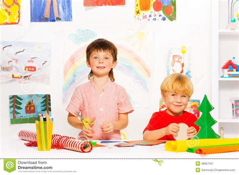 Boys Cutting Colorful Carton At The White Table Stock Image Image Of