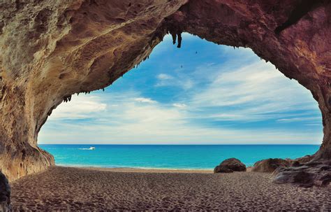 Caves On The Beach Cala Luna Sardinia Italy Red Background Images