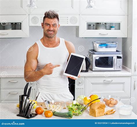 Happy Handsome Man Cooking In Kitchen At Home Stock Photo Image Of