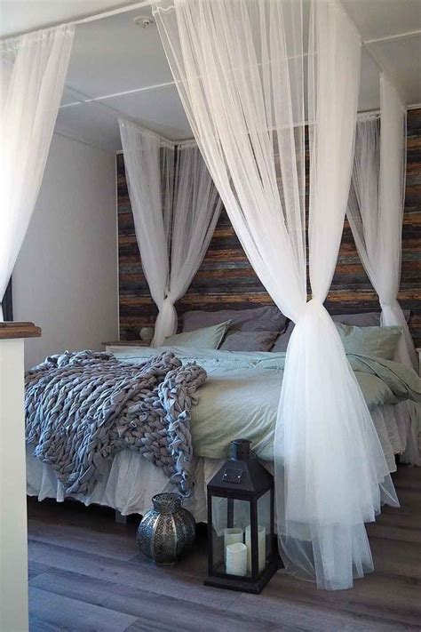 This modern bedroom uses architectural elements, such as a bare concrete wall, shelves, and wood floors as its primary decoration. 30 Best Canopy Bed Examples To Introduce Into Your Bedroom ...