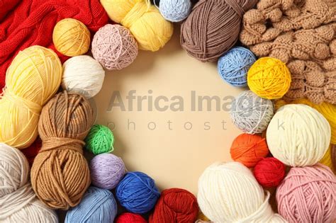 Frame Of Colorful Woolen Yarns On Beige Background Flat Lay Space For