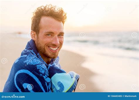Smiling Handsome Young Man Beauty Portrait On Beach At Sunset Looking