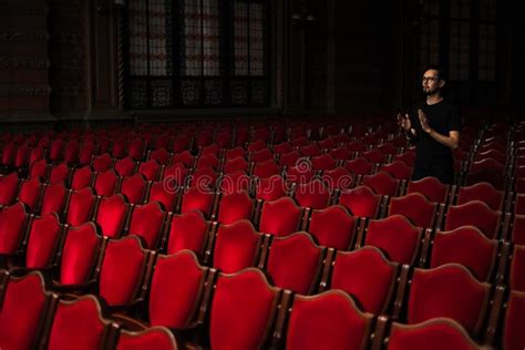 A Male Spectator In An Empty Concert Hall Applauds Standing Stock Image
