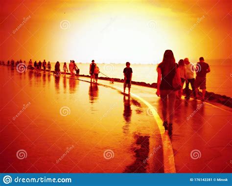 Beautiful Sunset Over Sea And Background With Silhouette Of Women And