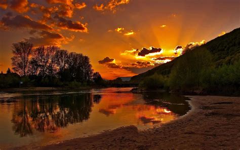 Sunset Sandy River Plazhacrveno Sky With Dark Cloud Reflection In