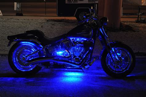 A Motorcycle Is Lit Up With Blue Lights