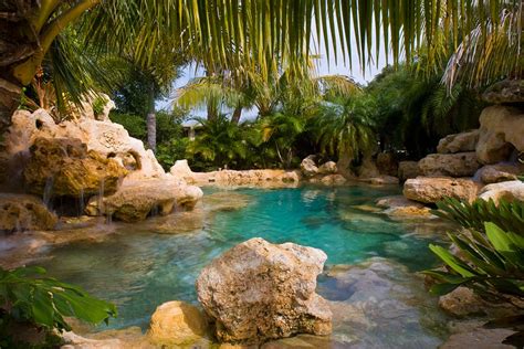 Natural Lagoon Swimming Pool With Sand Bottom And Waterfalls