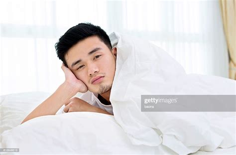 Sleepy Man In Bed High Res Stock Photo Getty Images