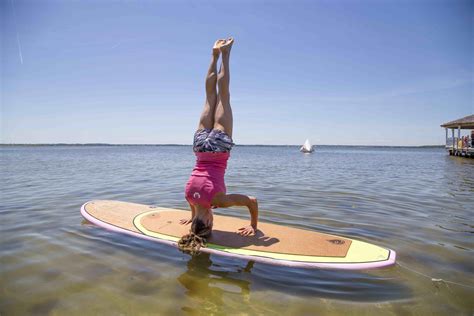 blog evolve paddle boards sup yoga board roots paddle boarding yoga yoga poses