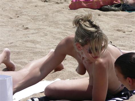 See And Save As Blond Milf Changing On The Beach For Topless Lovers