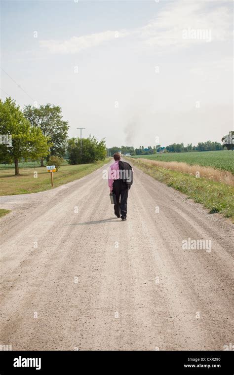 Man Walking Down Dirt Road Hi Res Stock Photography And Images Alamy