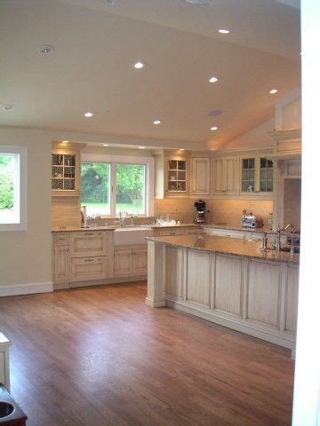Vaulted ceilings should be properly lit to enhance their appearance. vaulted kitchen ceiling with transom window above sink ...
