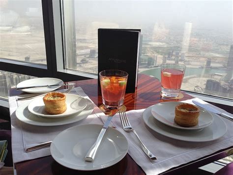 Dine At Burj Khalifa Atmosphere Dinner And Dubai By Night Tour