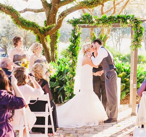 The Bride And Groom Share Their First Kiss As Mrand Mrs Ceremony Took