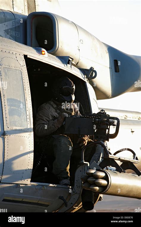 A Us Marine Door Gunner Awaits Launch Of A Us Marine Corps Uh 1y