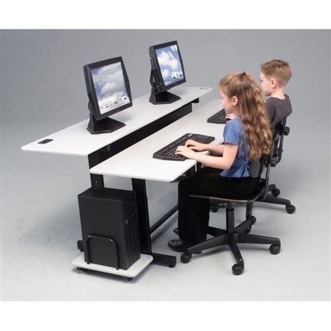 Featuring two independently height adjustable platforms to accommodate a variety of users, the split level is available in a 36 width for a single user, or in a. Balt Split-Level Adjustable Computer Table