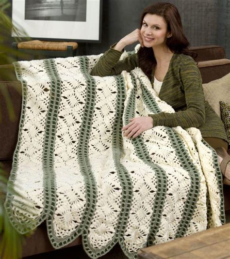 Free flower accents throw crochet pattern using red heart soft yarn. Fast Irish Panels Throw | AllFreeCrochetAfghanPatterns.com