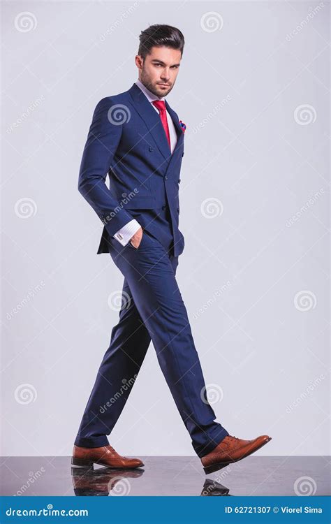 Serious Man In Suit Walking With Hands In Pockets Stock Image Image
