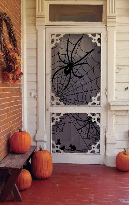 Pumpkins near the door for halloween. 50 Best Halloween Door Decorations for 2017