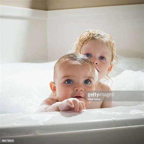 brother and sister playing in bath tub photos and premium high res pictures getty images