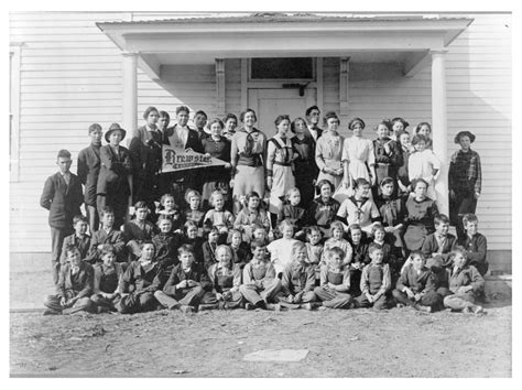 Group Of Students In Front Of A School Building Brewster Thomas
