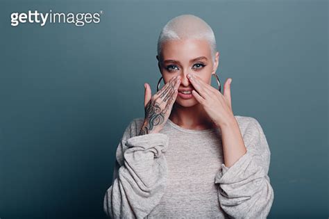 Millenial Young Woman With Short Blonde Hair Portrait Doing Face Yoga Self Facebuilding Massage