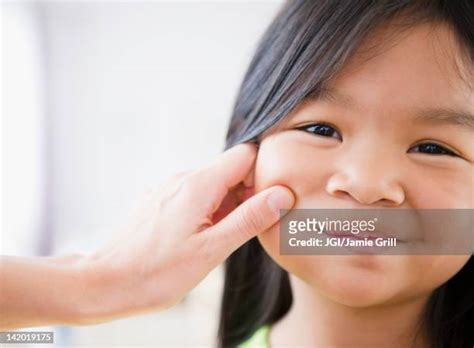 Pinch Cheek Asian Photos And Premium High Res Pictures Getty Images