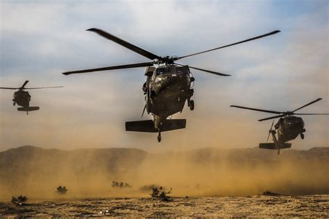 Air Assault Three Uh 60 Blackhawk Helicopters Carrying The Us Army