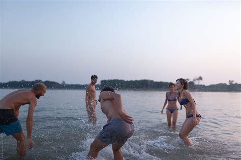 Friends Swimming During Sunset Del Colaborador De Stocksy Mattia Stocksy