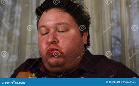 Portrait Of Expressive Fat Man Eating Burger Stock Footage Video Of