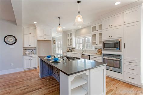 Learn how to properly measure your kitchen and check out our design tips for different kitchen floor plans. An open floor plan kitchen with shaker style cabinets, built-in appliances, and bookcase ...