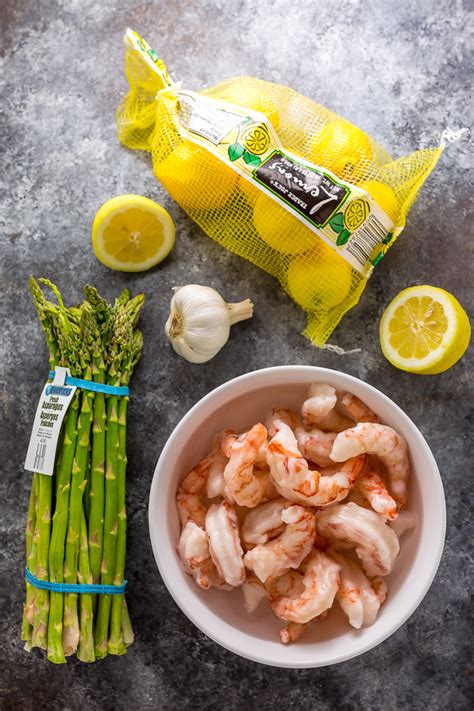 Stir in wine and lemon juice and bring to a boil, remove from heat and serve. Lemon Garlic Shrimp and Asparagus - Baker by Nature