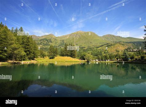 View On Small Alpine Lake Among The Peaks Of Alps In Northern Italy