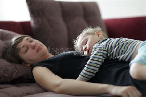Tired Worker Mother Sleeping Beside Her Daughter Stock Photo Image Of