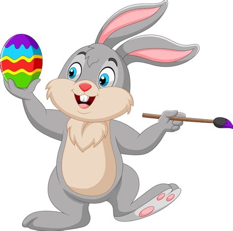 Premium Vector Cartoon Rabbit Painting An Easter Egg