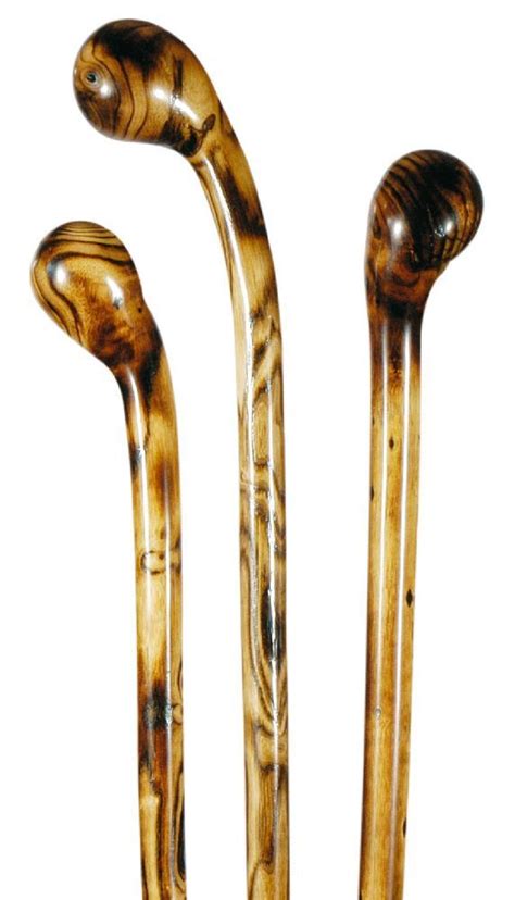 Two Wooden Canes Sitting Next To Each Other
