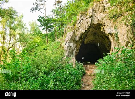 Entrance To Natural Cave In The Forrest Ancient Tunnel In The Rock