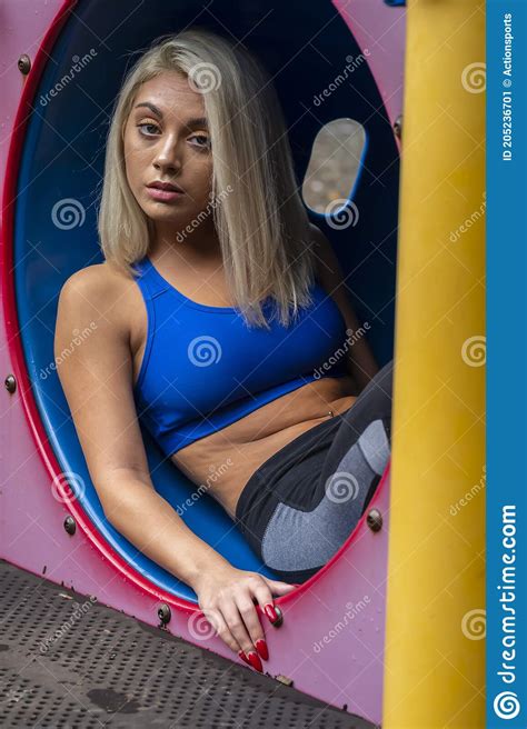 A Young Lovely Blonde Model Works Out Outdoors While Enjoying A Summers Day Stock Image Image