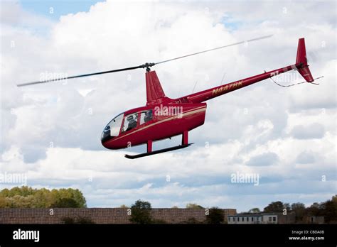 Robinson R44 Turbine N4478k In Flight At Breighton Airfield Stock Photo