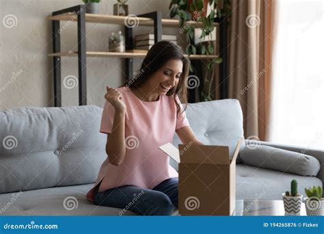 Happy Ethnic Woman Satisfied With Internet Order Delivery Stock Photo