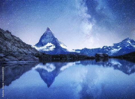 Matterhorn And Reflection On The Water Surface At The Night Time Milky