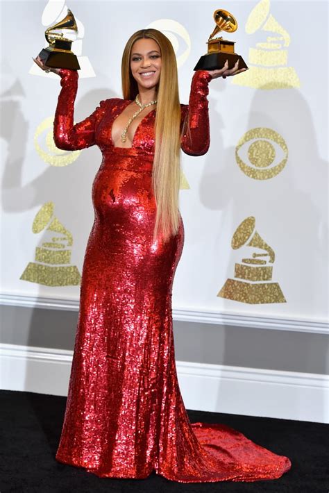 Wearing A Red Bodycon Dress By Peter Dundas To The Grammy Awards In