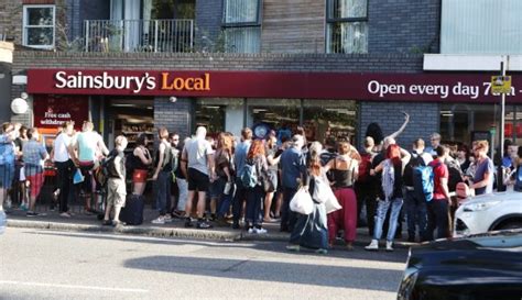 hundreds stage sainsbury s kiss in after gay couple kicked out for holding hands metro news